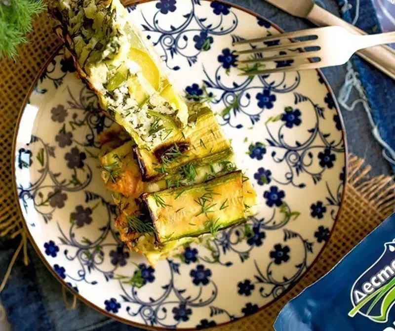 Layered milk moussaka dish with zucchini